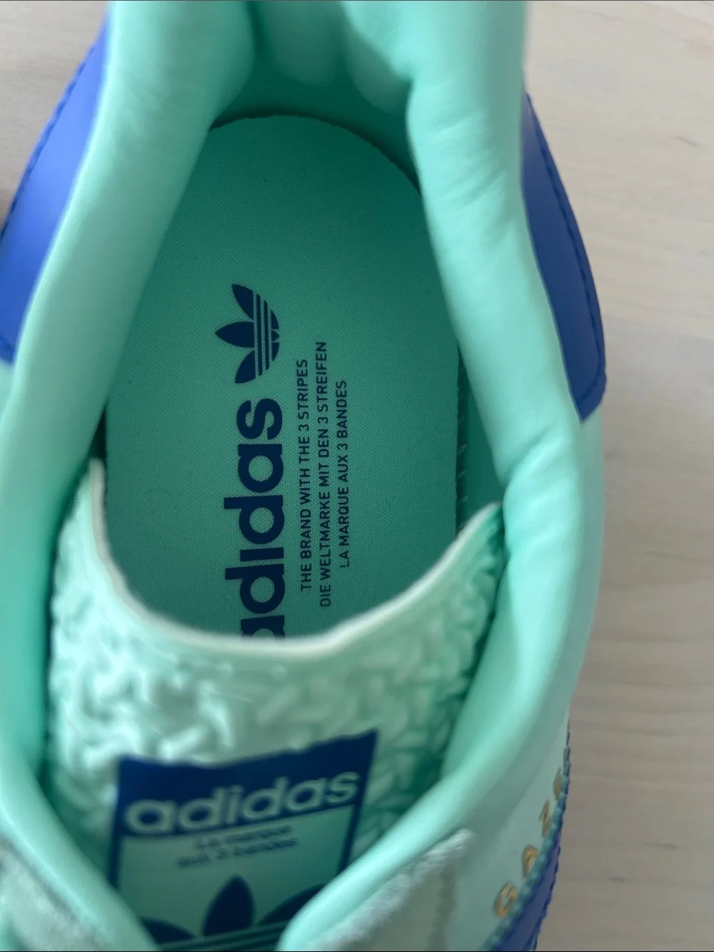 adidas Women’s Mint Green Sneakers with Blue Stripes